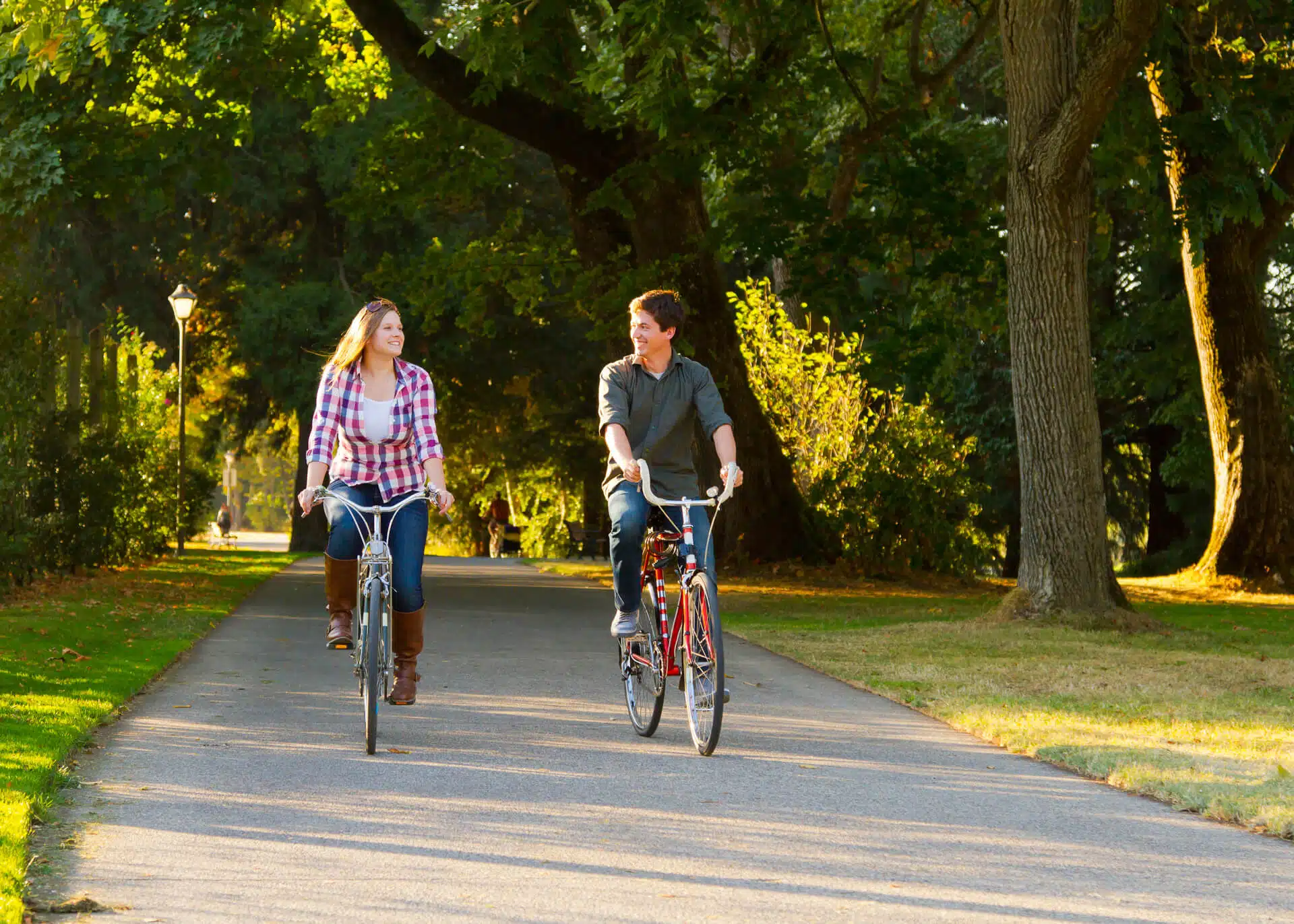 couple riding bikes in the park