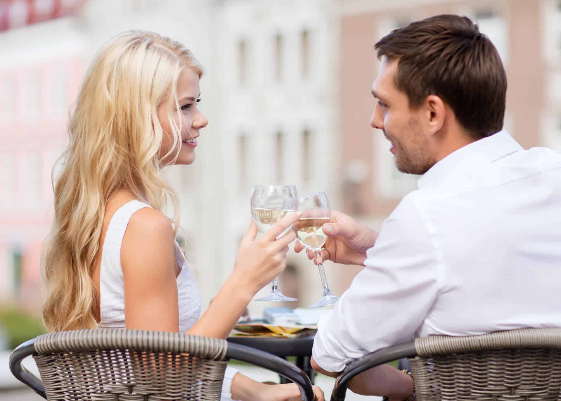 couple on a date toasting with wine