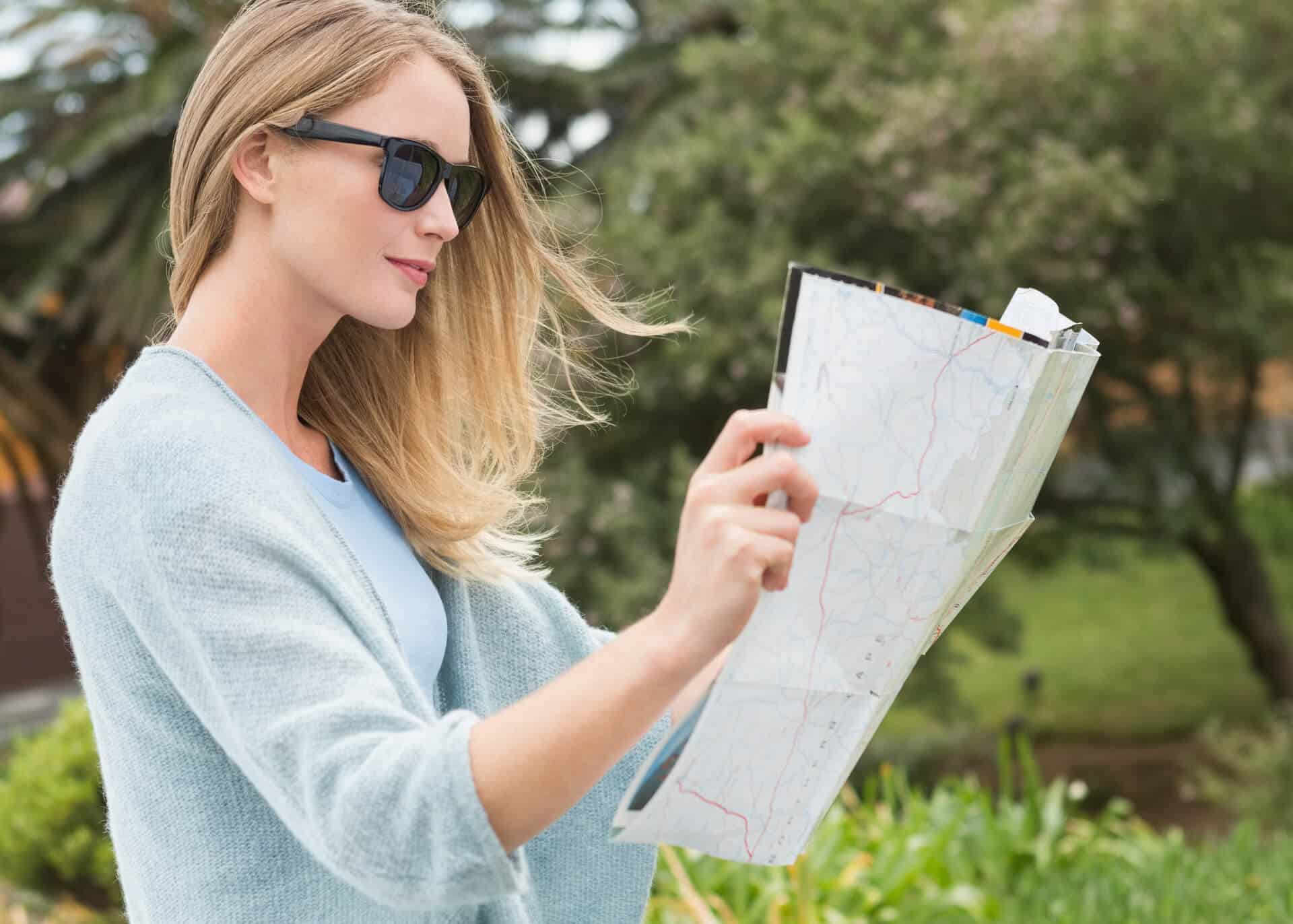 young woman reading a map