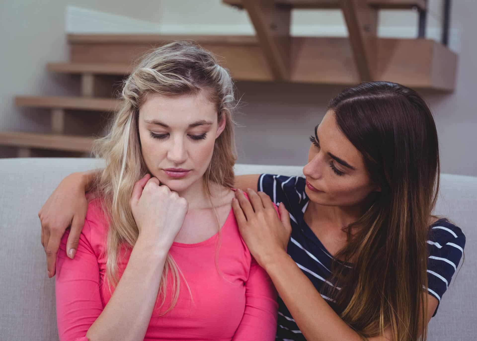 woman comforting an upset friend