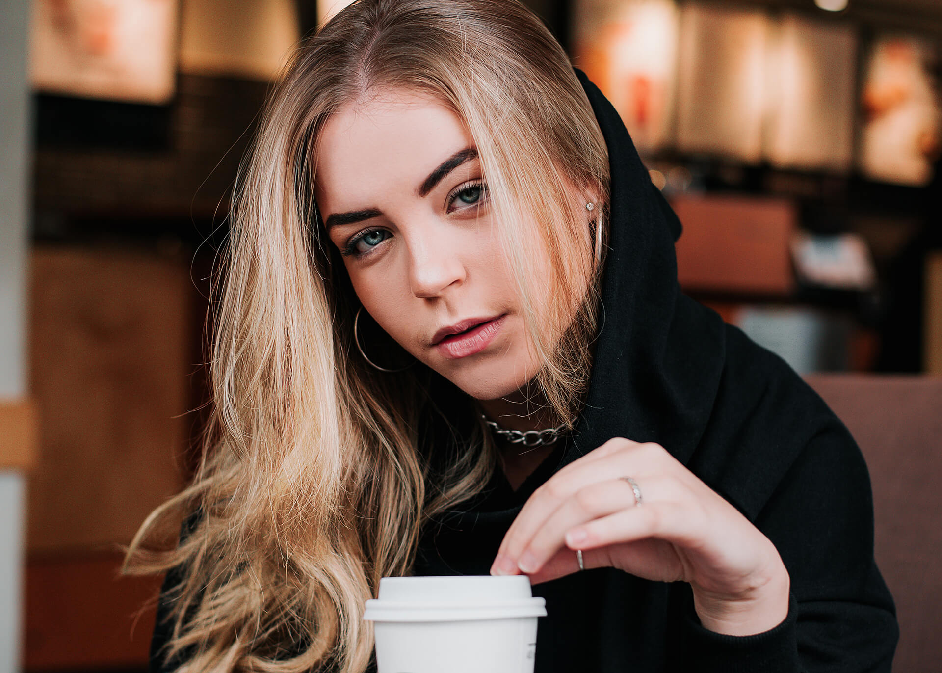 girl with cofee looking at you