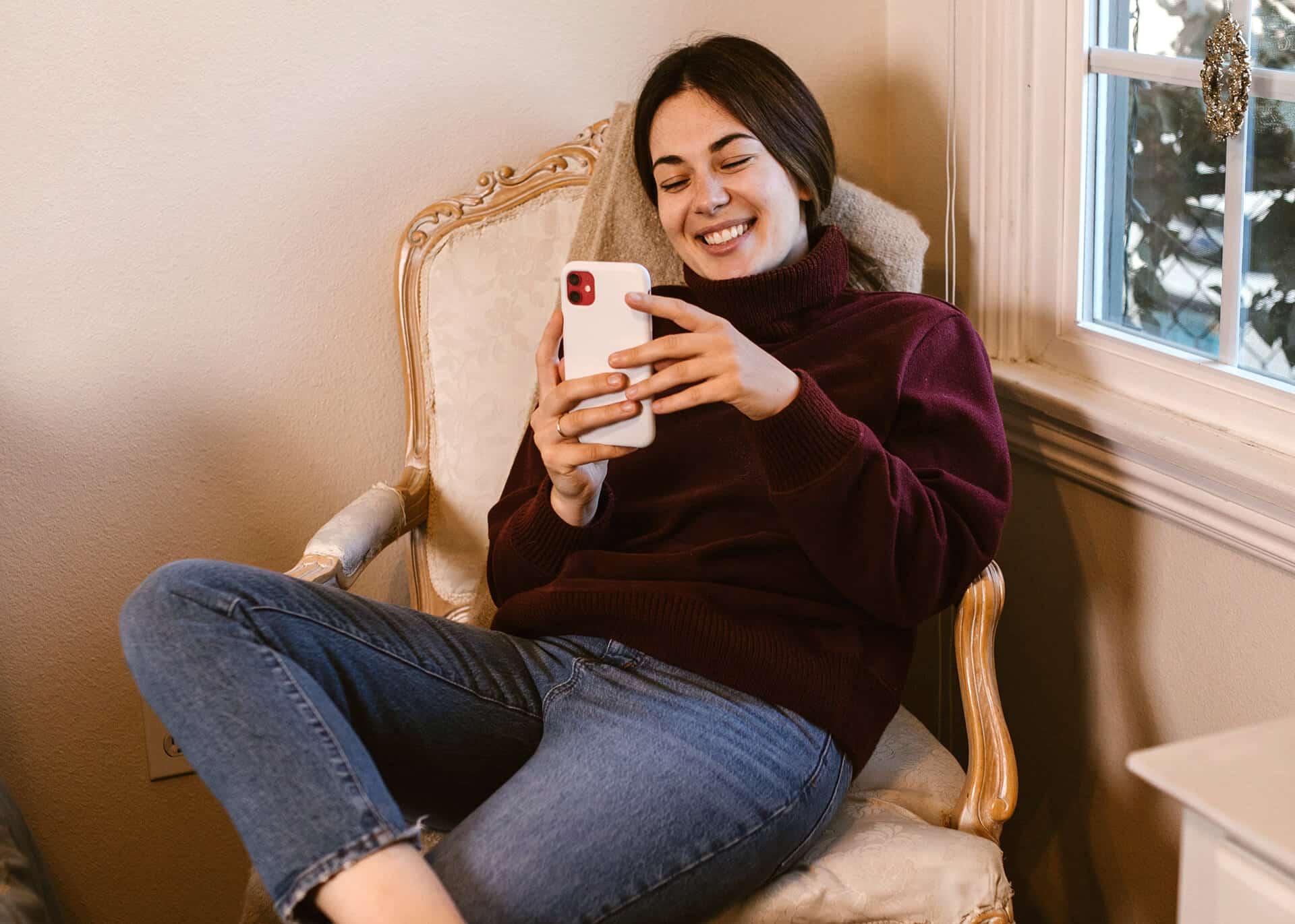 smiling woman reading text message