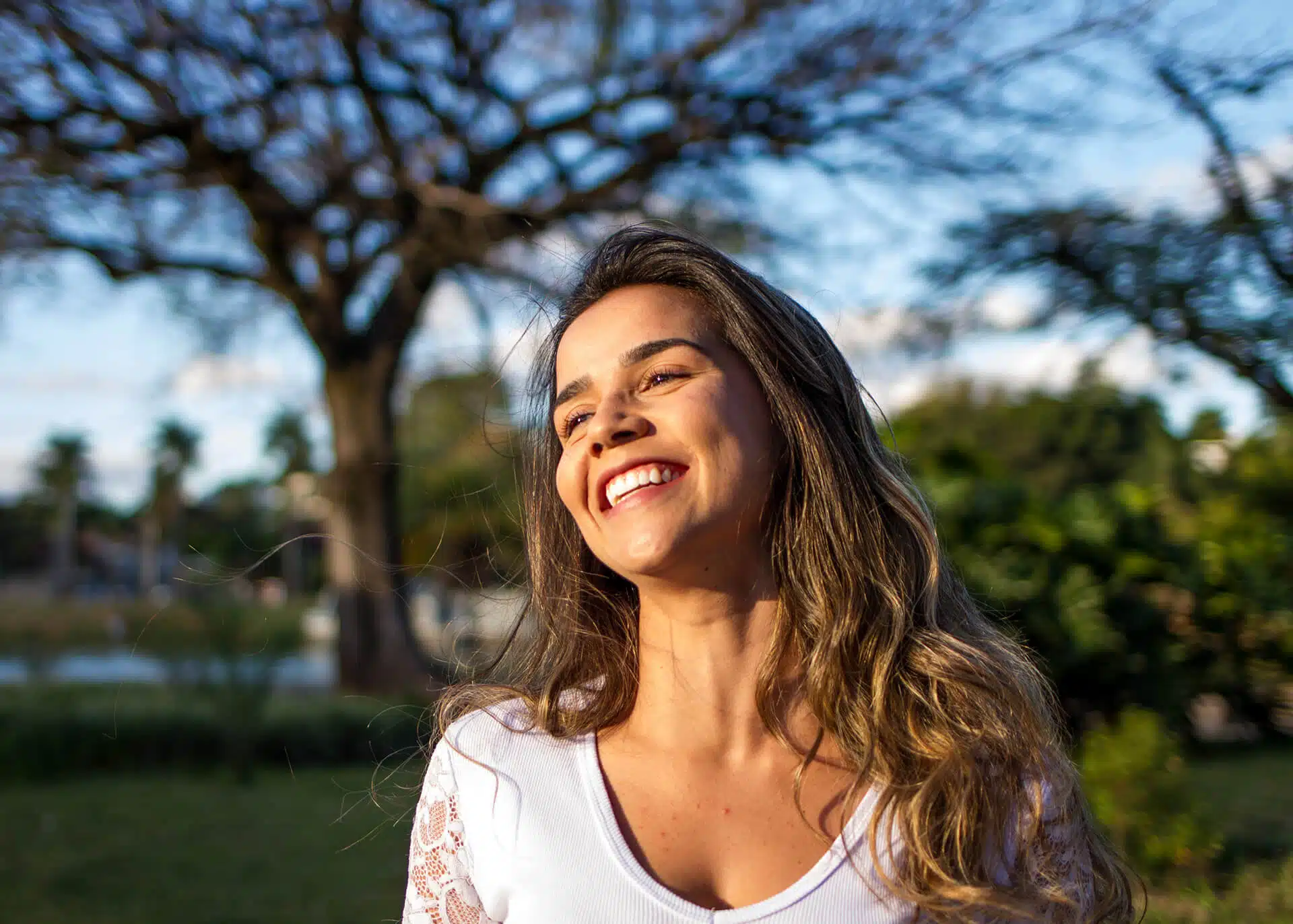 smiling woman in white top