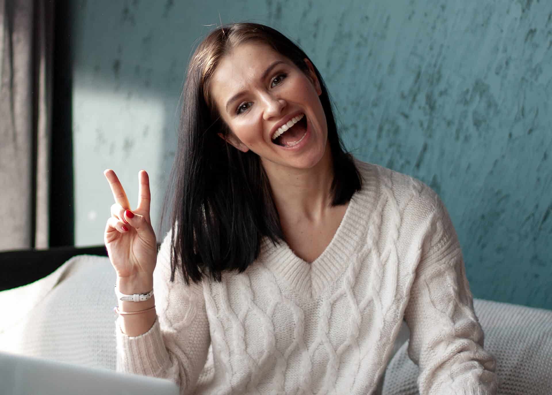 woman showing victory sign