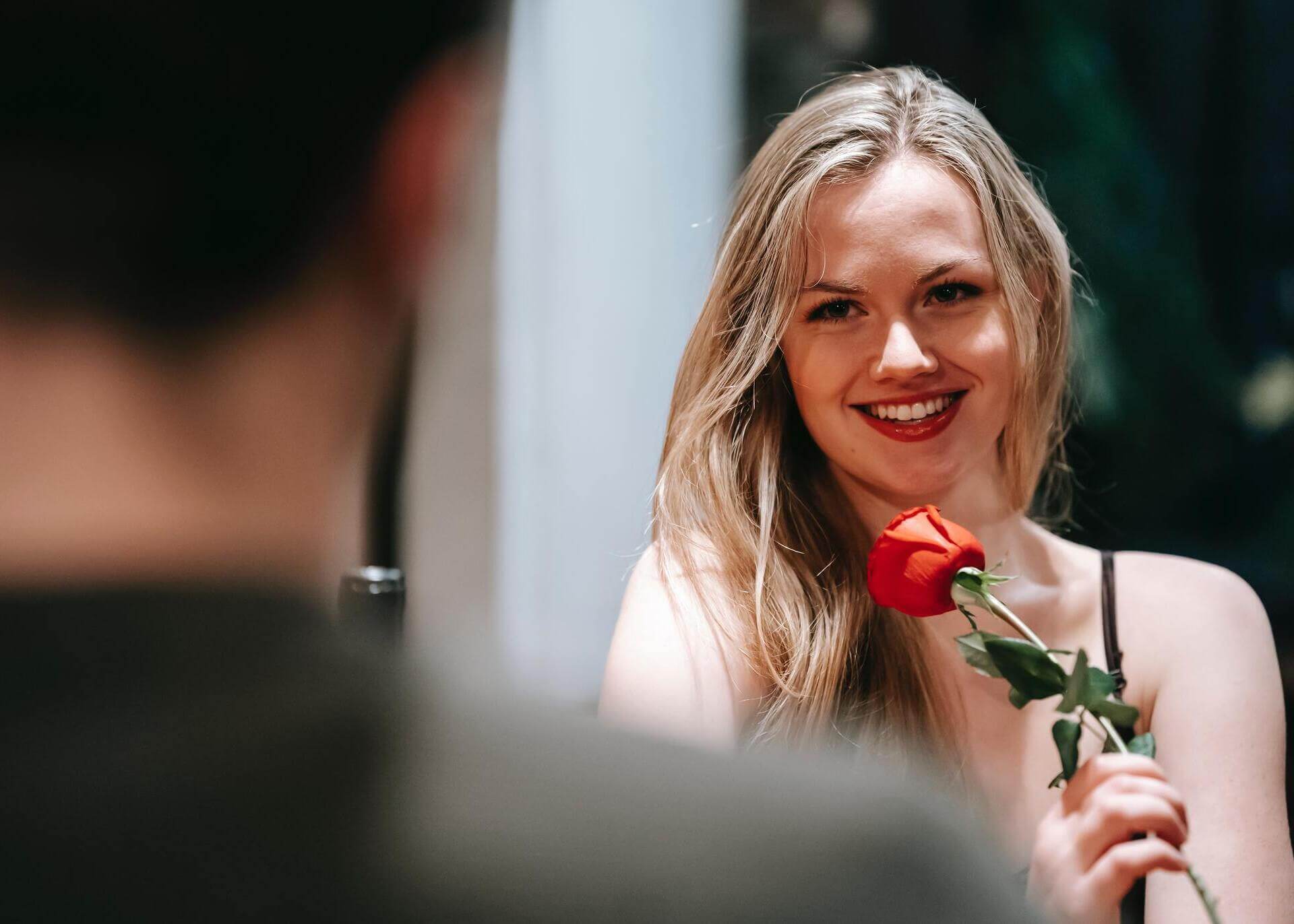 woman receiving flower on a date