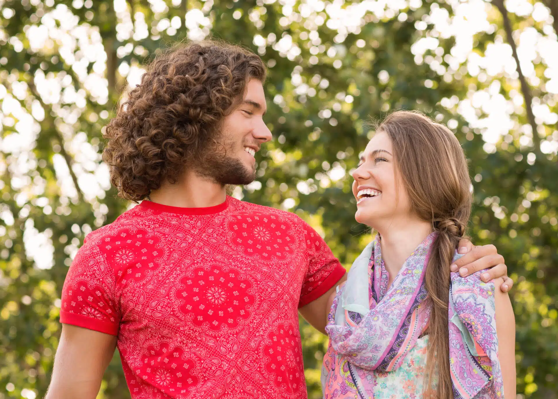 couple smiling in the park