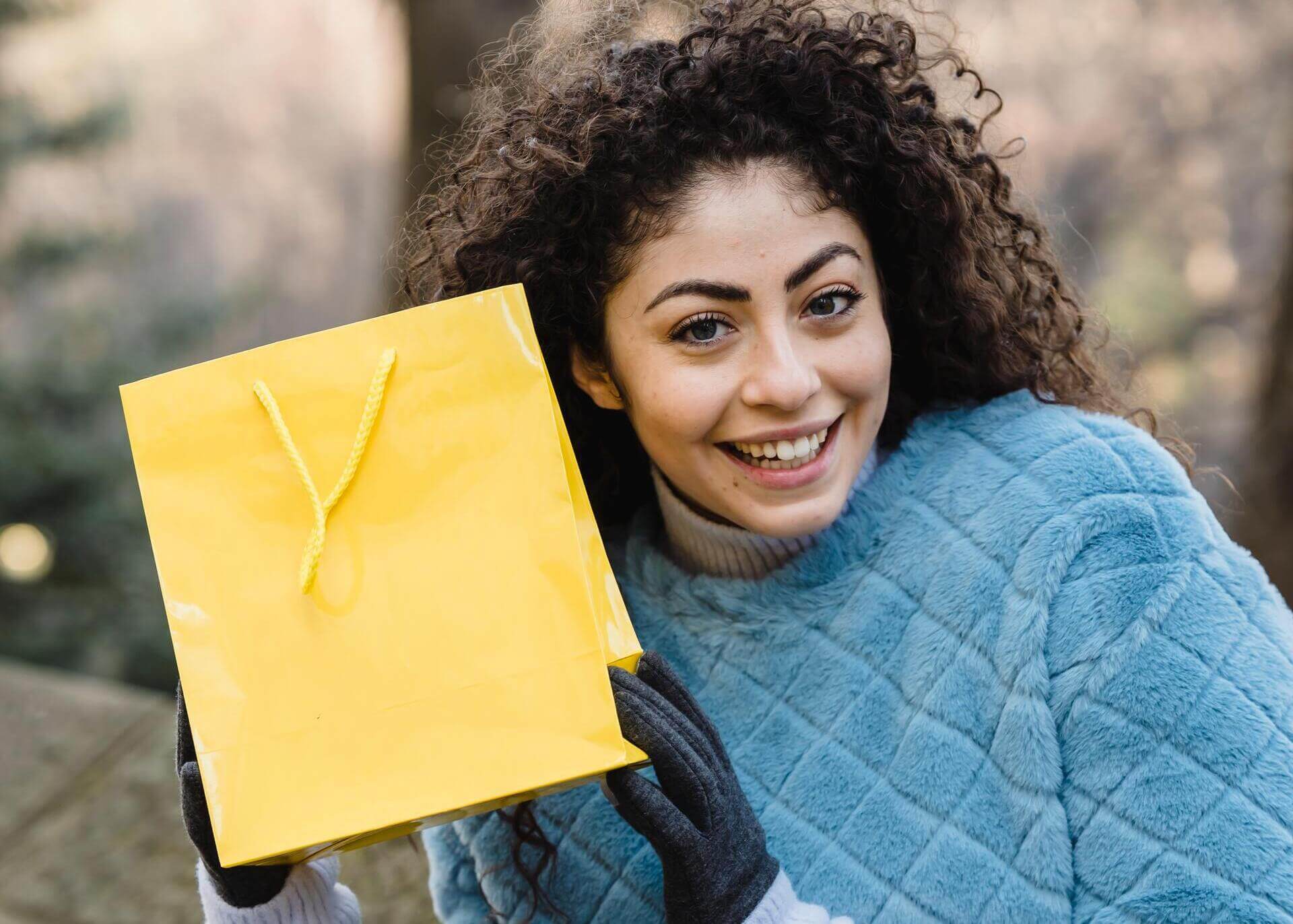 woman holding a gift bag