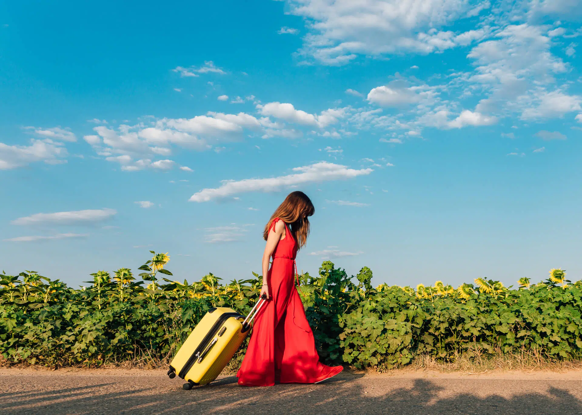 sad woman walking with suitcase
