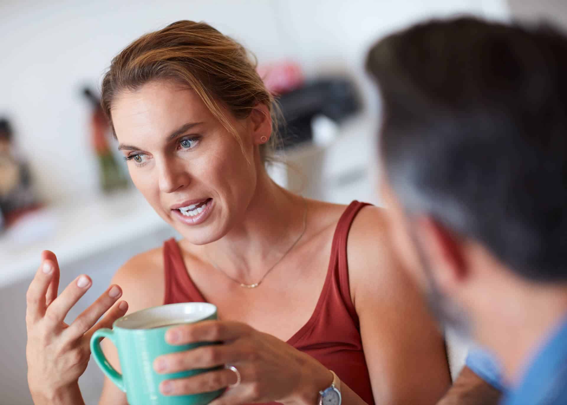 young woman having serious conversation with her partner