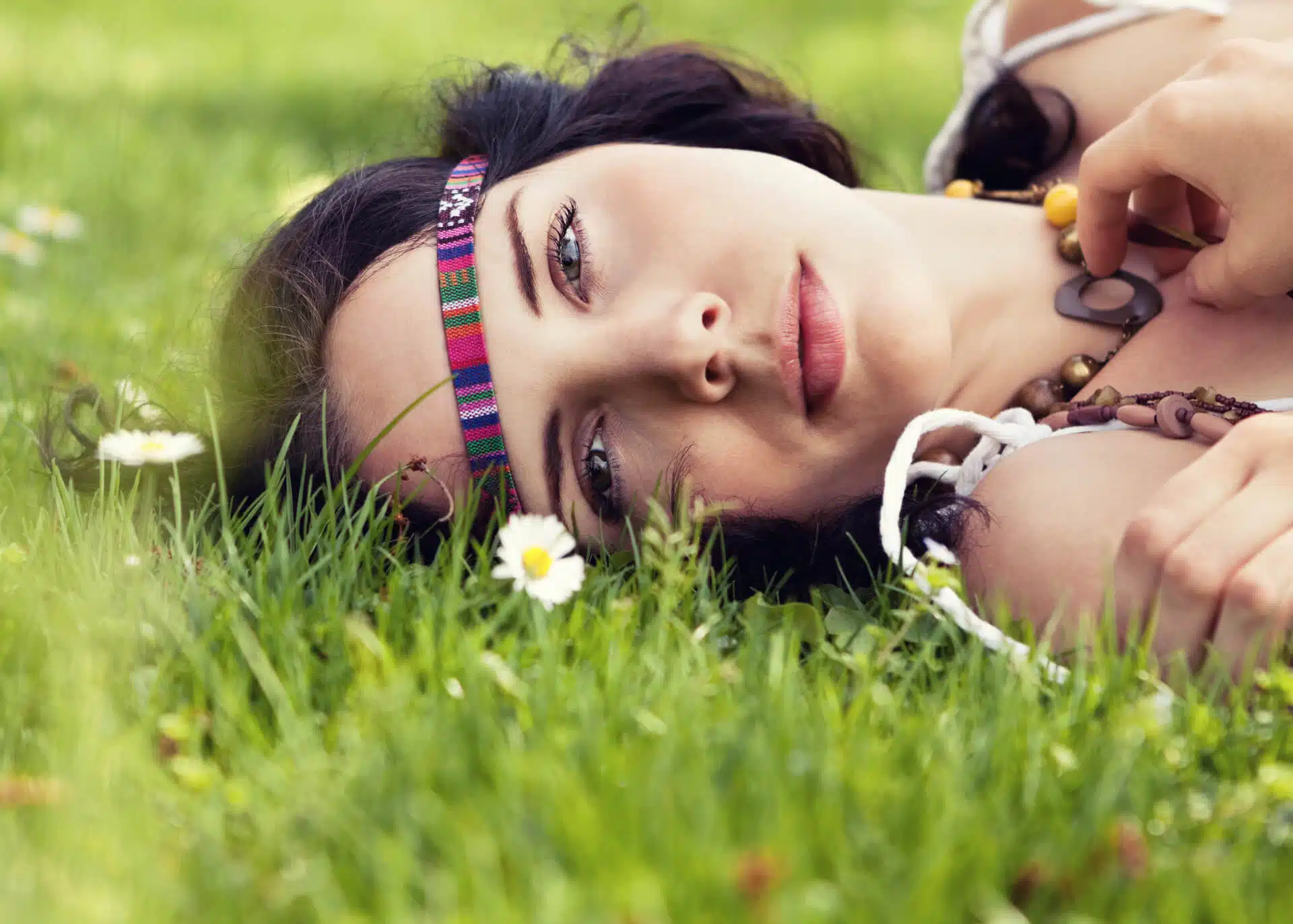 dreamy woman laying on the grass