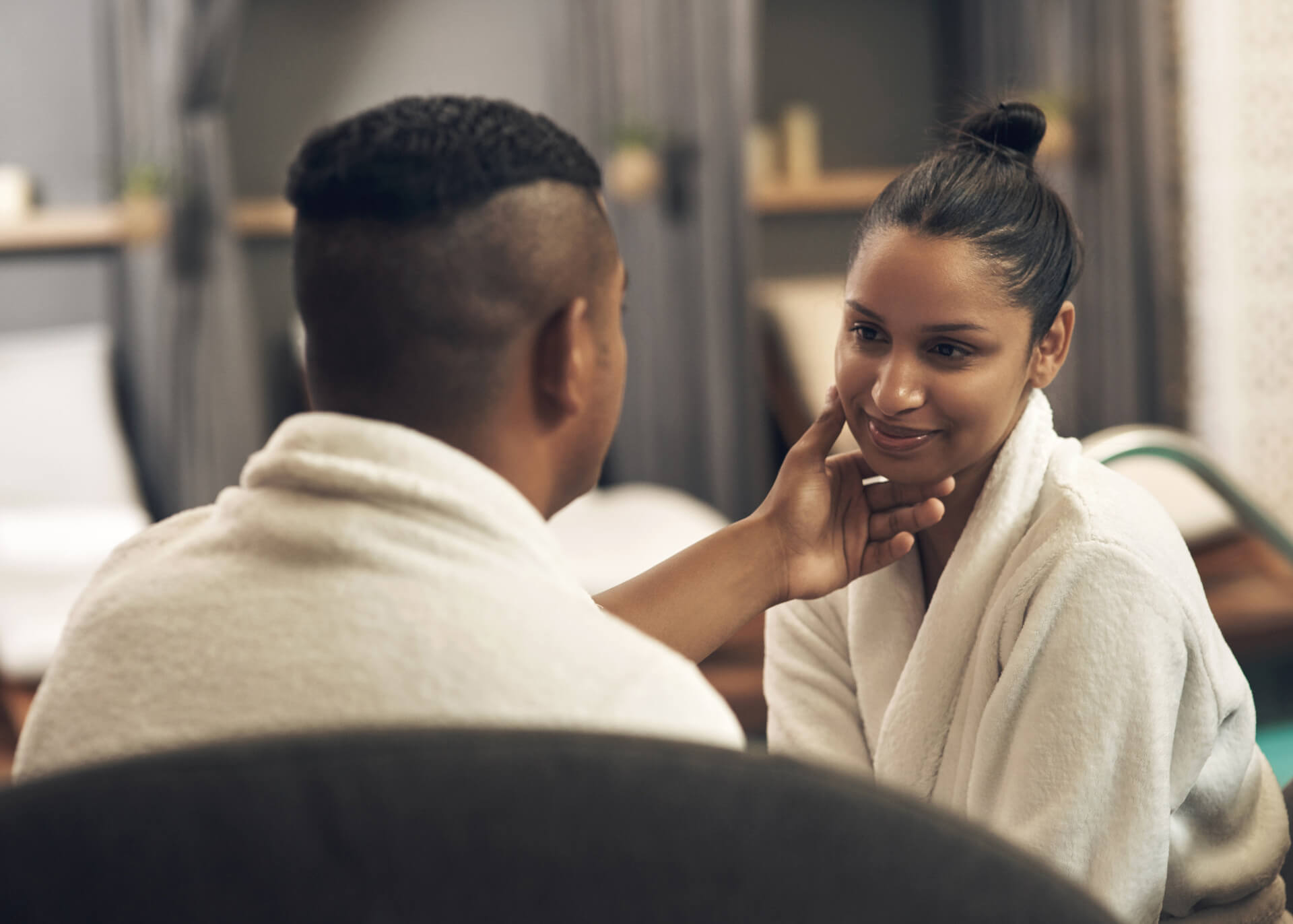 couple in a spa looking at each other