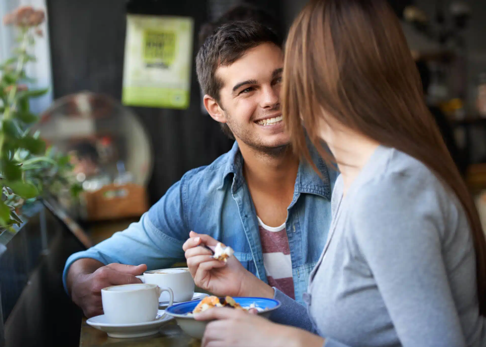young couple having a conversation in a cafe