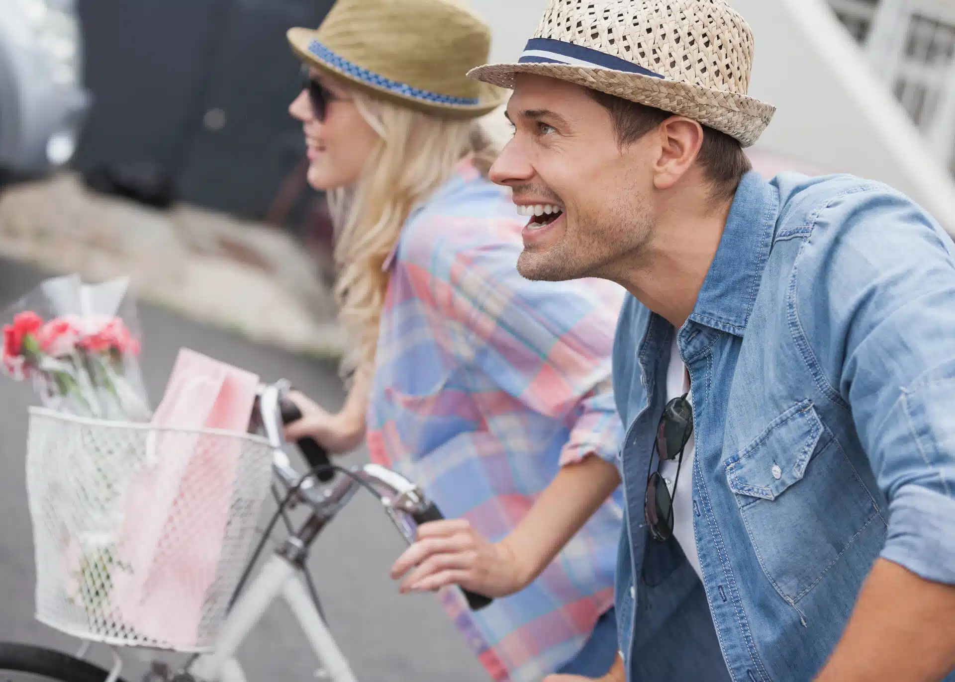 young couple riding bikes