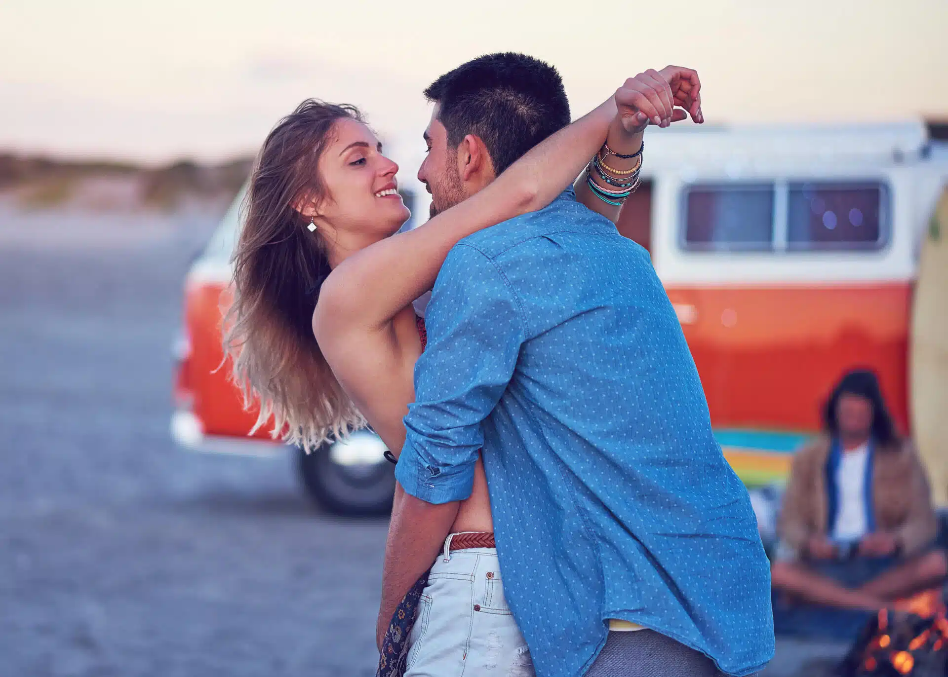young woman embracing her boyfriend looking into his eyes