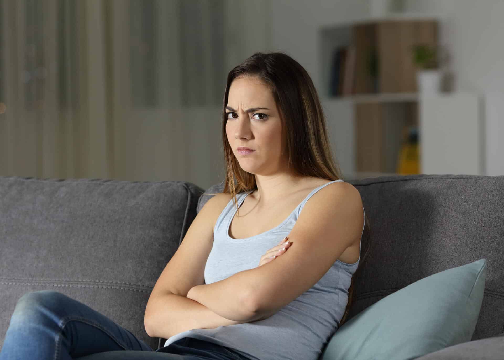 angry young woman with crossed arms