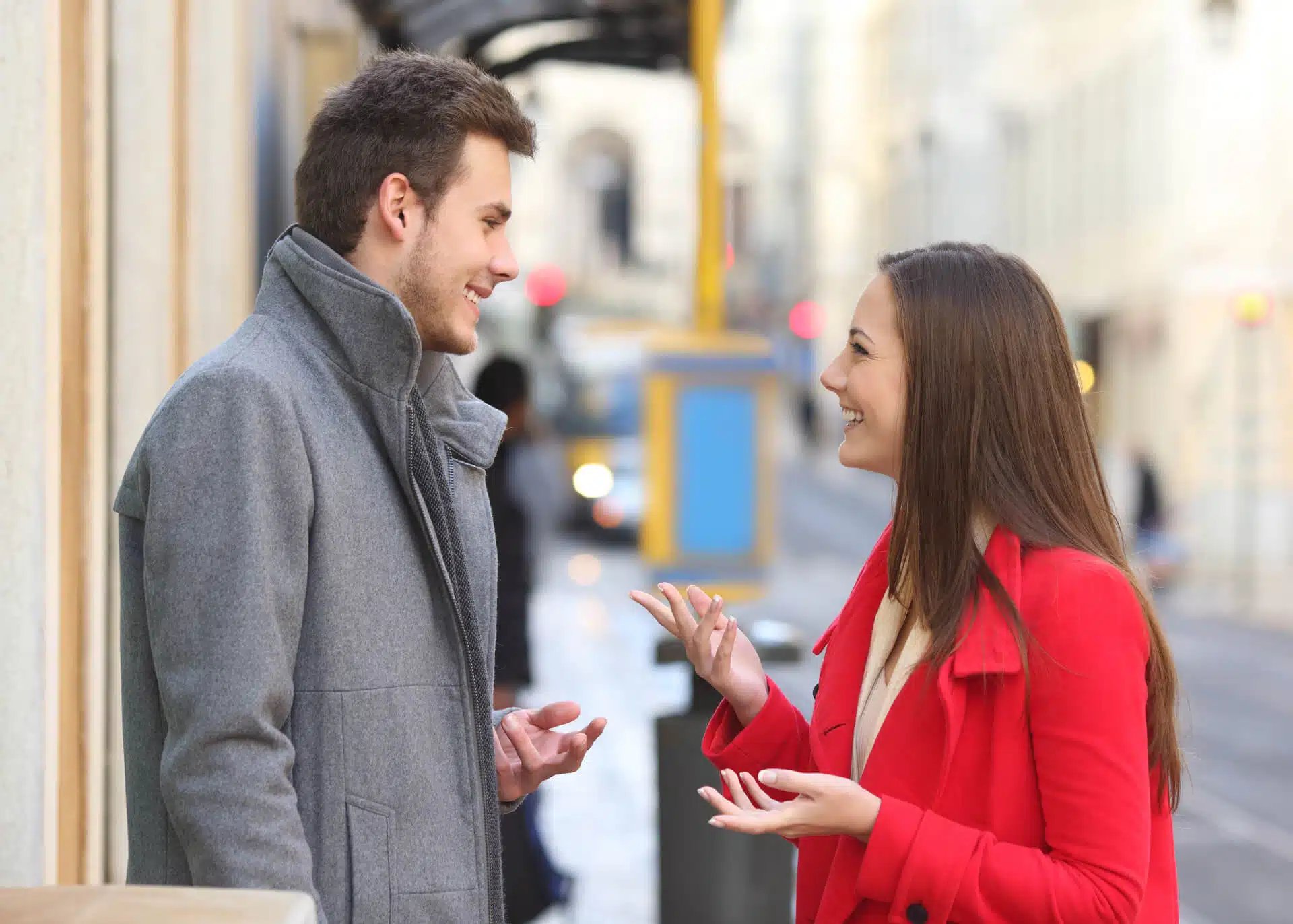 young couple talking in the street
