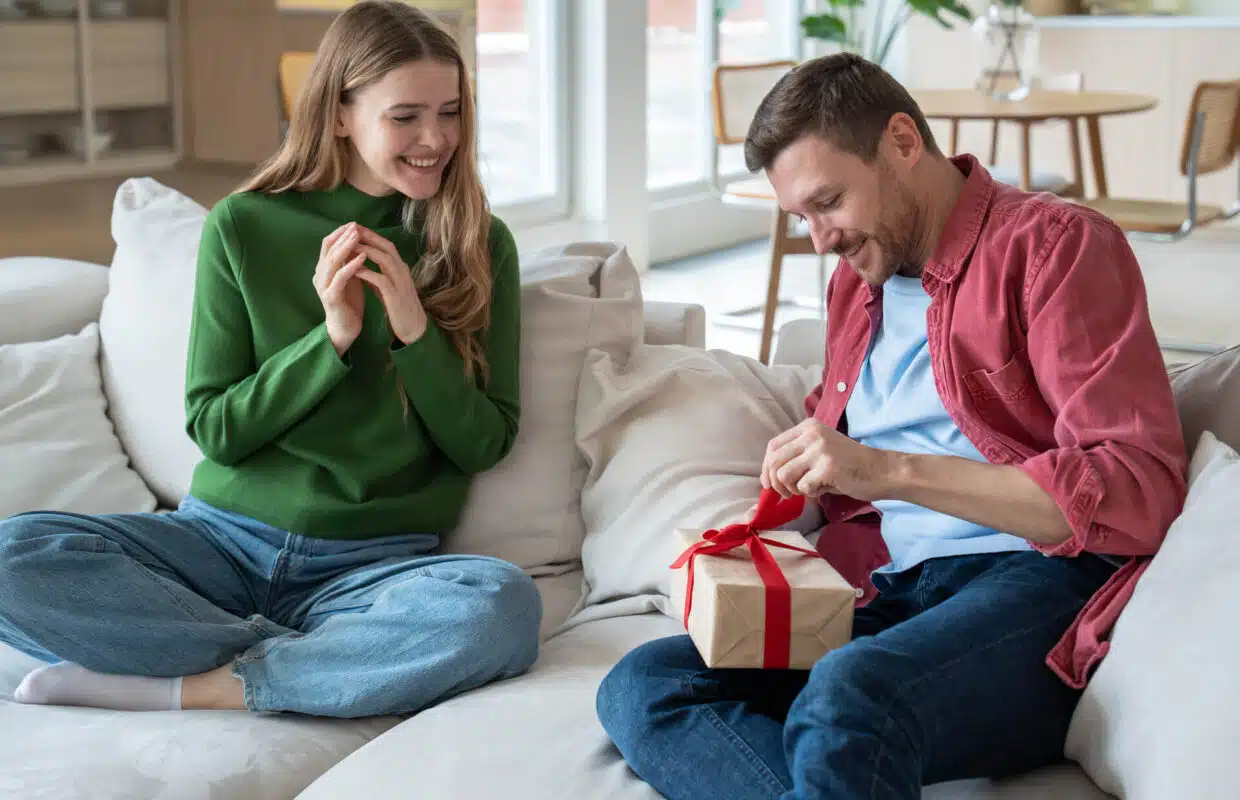 girlfriend giving a gift to gemini man